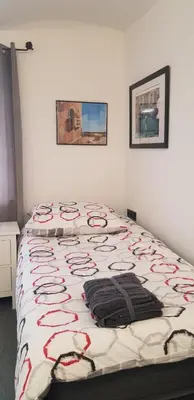 Ein Bett oder Betten in einem Zimmer der Unterkunft Hotel Adriana