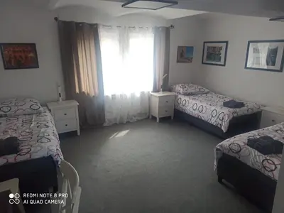 Ein Bett oder Betten in einem Zimmer der Unterkunft Hotel Adriana