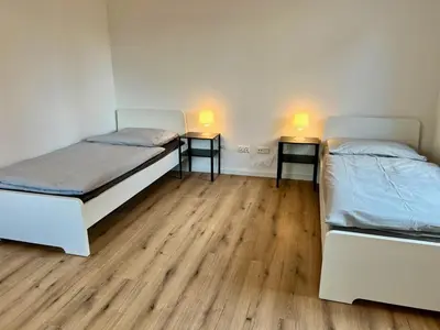 Ein Bett oder Betten in einem Zimmer der Unterkunft Monteur- und Ferienwohnung Lingenfeld