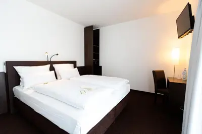 Ein Bett oder Betten in einem Zimmer der Unterkunft Tobbaccon Hotel