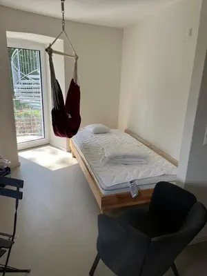 Ein Bett oder Betten in einem Zimmer der Unterkunft FlaKturm Wertheim