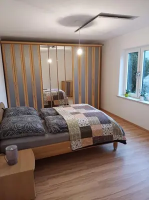 Ein Bett oder Betten in einem Zimmer der Unterkunft Das Tor zum Odenwald