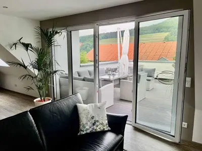 Ein Sitzbereich in der Unterkunft Ferienwohnung Weingut Sturm