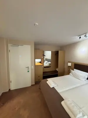 Ein Bett oder Betten in einem Zimmer der Unterkunft Hotel Ortel GmbH