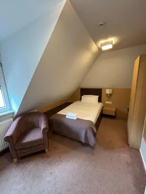 Ein Bett oder Betten in einem Zimmer der Unterkunft Hotel Ortel GmbH