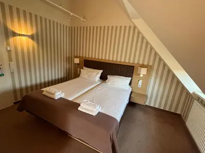 Ein Bett oder Betten in einem Zimmer der Unterkunft Hotel Ortel GmbH