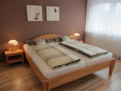 Ein Bett oder Betten in einem Zimmer der Unterkunft Ferienhaus Mandelblüte