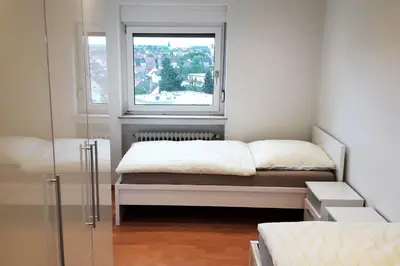 Ein Bett oder Betten in einem Zimmer der Unterkunft City Apartment near Heidelberg