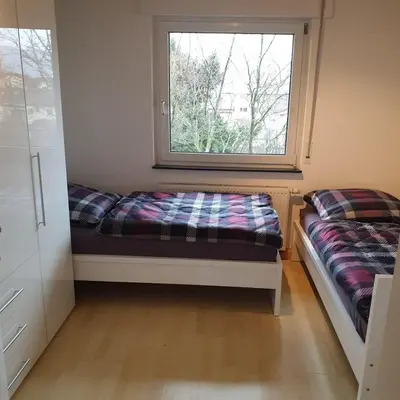 Ein Bett oder Betten in einem Zimmer der Unterkunft City Apartment in Eppelheim