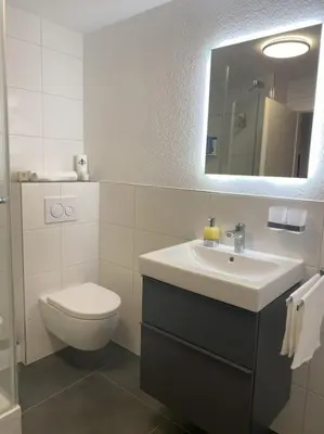 Ein Badezimmer in der Unterkunft Ferienwohnung S19 - City-Apartment 33