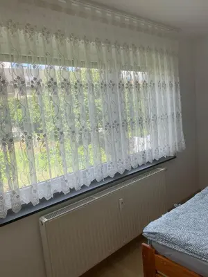 Ein Bett oder Betten in einem Zimmer der Unterkunft Ferienwohnung Grimm 2