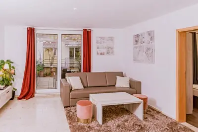 Ein Sitzbereich in der Unterkunft Stylishes Apartement Poststraße 36