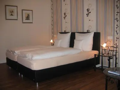 Ein Bett oder Betten in einem Zimmer der Unterkunft Gästehaus Oswald