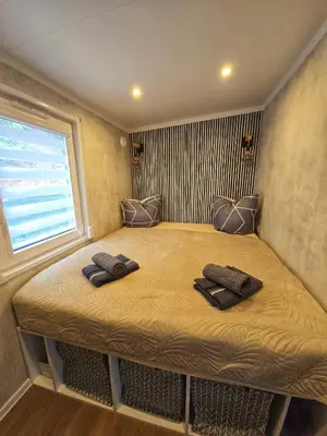Ein Bett oder Betten in einem Zimmer der Unterkunft Tiny House im Felsenland mit Sauna