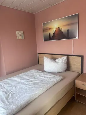 Ein Bett oder Betten in einem Zimmer der Unterkunft Gemütliche Ferienwohnung in Rödermark