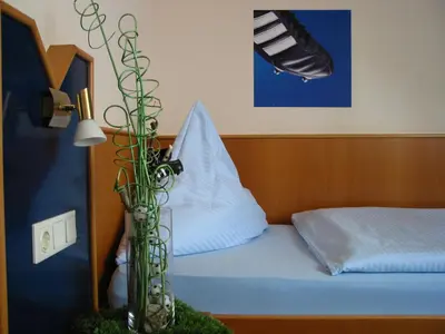 Ein Bett oder Betten in einem Zimmer der Unterkunft Gästehaus Kraft
