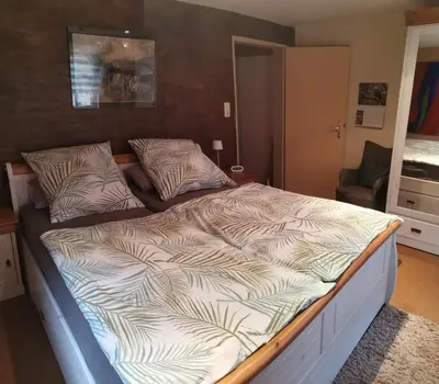 Ein Bett oder Betten in einem Zimmer der Unterkunft FeWo an der Enz