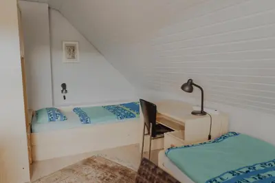 Ein Bett oder Betten in einem Zimmer der Unterkunft separates Apartment im DG für 2 Personen