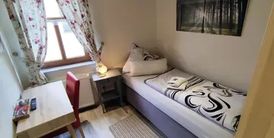 Ein Bett oder Betten in einem Zimmer der Unterkunft Pension Zur Schlummerstube