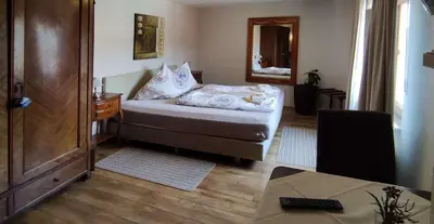 Ein Bett oder Betten in einem Zimmer der Unterkunft Pension Zur Schlummerstube
