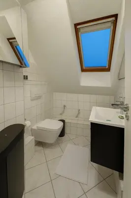 Ein Badezimmer in der Unterkunft Zentrale Maisonette mit Büro & Parkplatz