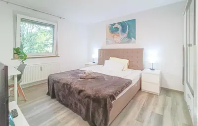 Ein Bett oder Betten in einem Zimmer der Unterkunft Parkplatz - Zentral - modern - 3-Zi 5x Pers