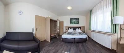 Ein Bett oder Betten in einem Zimmer der Unterkunft Hotel Lorca