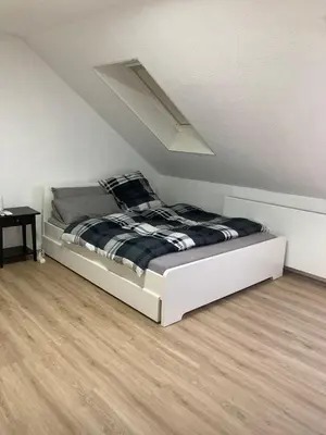 Ein Bett oder Betten in einem Zimmer der Unterkunft Weitblick