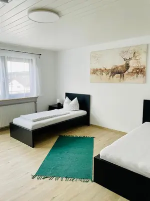 Ein Bett oder Betten in einem Zimmer der Unterkunft Panoramablick Ferien- und Monteurwohnung OG