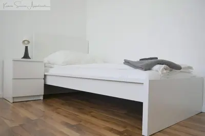 Ein Bett oder Betten in einem Zimmer der Unterkunft Moderne 3-Zimmer-Wohnung für bis zu 7 Personen