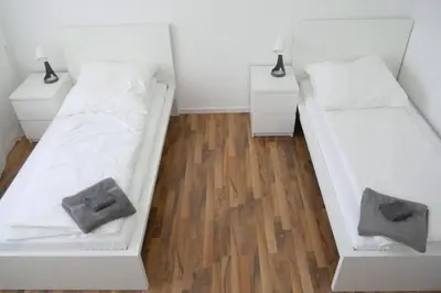 Ein Bett oder Betten in einem Zimmer der Unterkunft Moderne 3-Zimmer-Wohnung für bis zu 7 Personen