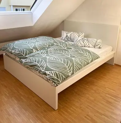 Ein Bett oder Betten in einem Zimmer der Unterkunft Schicke helle Galeriewohnung