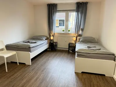 Ein Bett oder Betten in einem Zimmer der Unterkunft Hyra Living- Apartment in Ilsfeld nahe A81