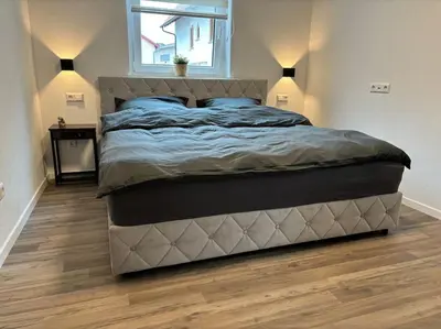 Ein Bett oder Betten in einem Zimmer der Unterkunft Ferienwohnung in der Südpfalz