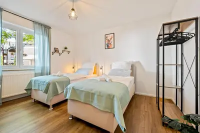Ein Bett oder Betten in einem Zimmer der Unterkunft 3BR - Apartment am Theater