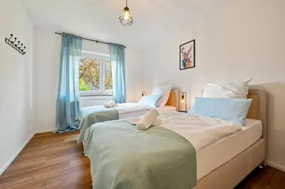 Ein Bett oder Betten in einem Zimmer der Unterkunft 3BR - Apartment am Theater