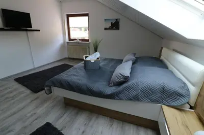 Ein Bett oder Betten in einem Zimmer der Unterkunft Ferienwohnung Waldblick Dahn