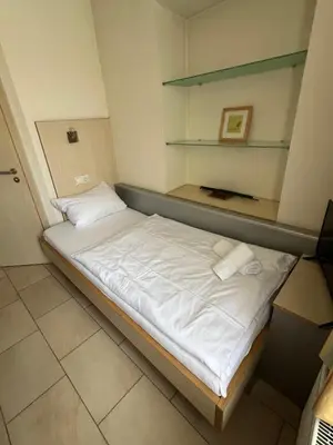 Ein Bett oder Betten in einem Zimmer der Unterkunft Hotel Pfälzer Hof