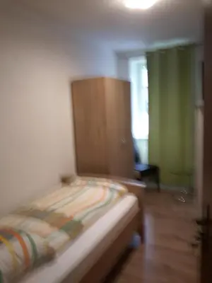 Ein Bett oder Betten in einem Zimmer der Unterkunft Hotel Zum Schwanen