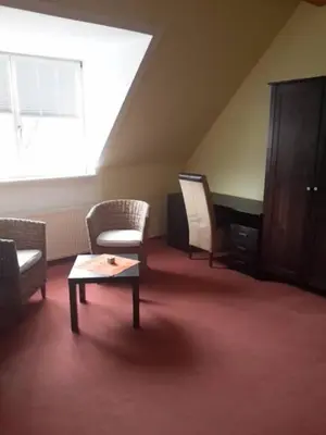 Ein Sitzbereich in der Unterkunft Hotel Zum Schwanen