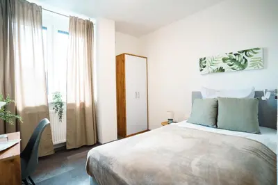 Ein Bett oder Betten in einem Zimmer der Unterkunft Hotel am Schafbaum