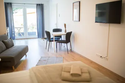Ein Sitzbereich in der Unterkunft HUGOS Studio Apartment