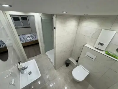 Ein Badezimmer in der Unterkunft City Apart 3 nahe Badewelt, Museum & Bahnhof mit NETFLIX