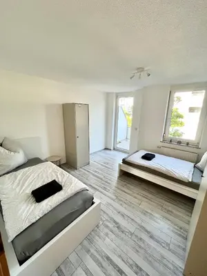 Ein Bett oder Betten in einem Zimmer der Unterkunft Audi - Neckarsulm - Bad - Küche - Balkon - 4 Personen