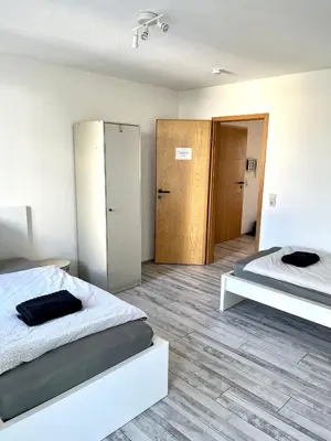 Ein Bett oder Betten in einem Zimmer der Unterkunft Audi - Neckarsulm - Bad - Küche - Balkon - 4 Personen