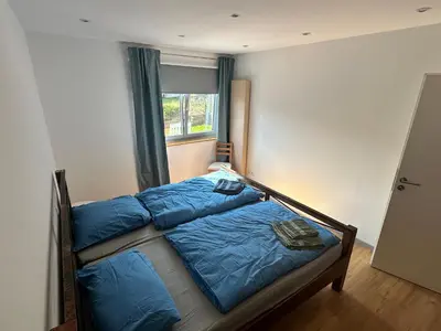 Ein Bett oder Betten in einem Zimmer der Unterkunft Ferienwohnung am Kastanienbusch