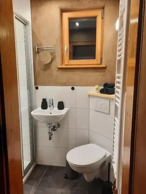 Ein Badezimmer in der Unterkunft Heimschneiderei