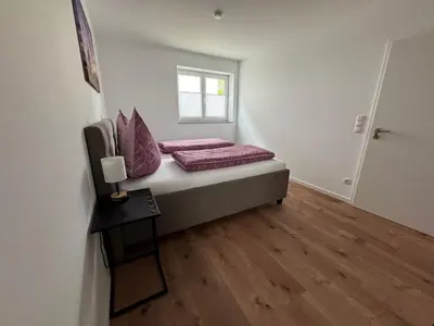 Ein Bett oder Betten in einem Zimmer der Unterkunft Ferienwohnung Pfälzer Auszeit