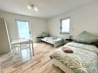 Ein Bett oder Betten in einem Zimmer der Unterkunft Ganze Wohnung - Parkplatz - Wi-fi - Küche - Balkon