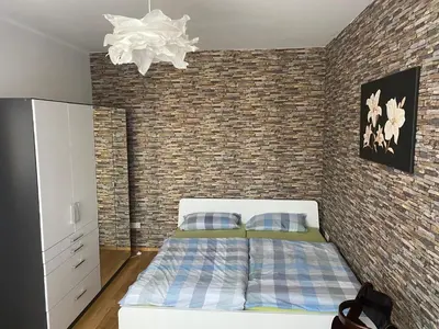Ein Bett oder Betten in einem Zimmer der Unterkunft Zentrale 3 Zimmerwohnung mit kostenlosem Stellplatz